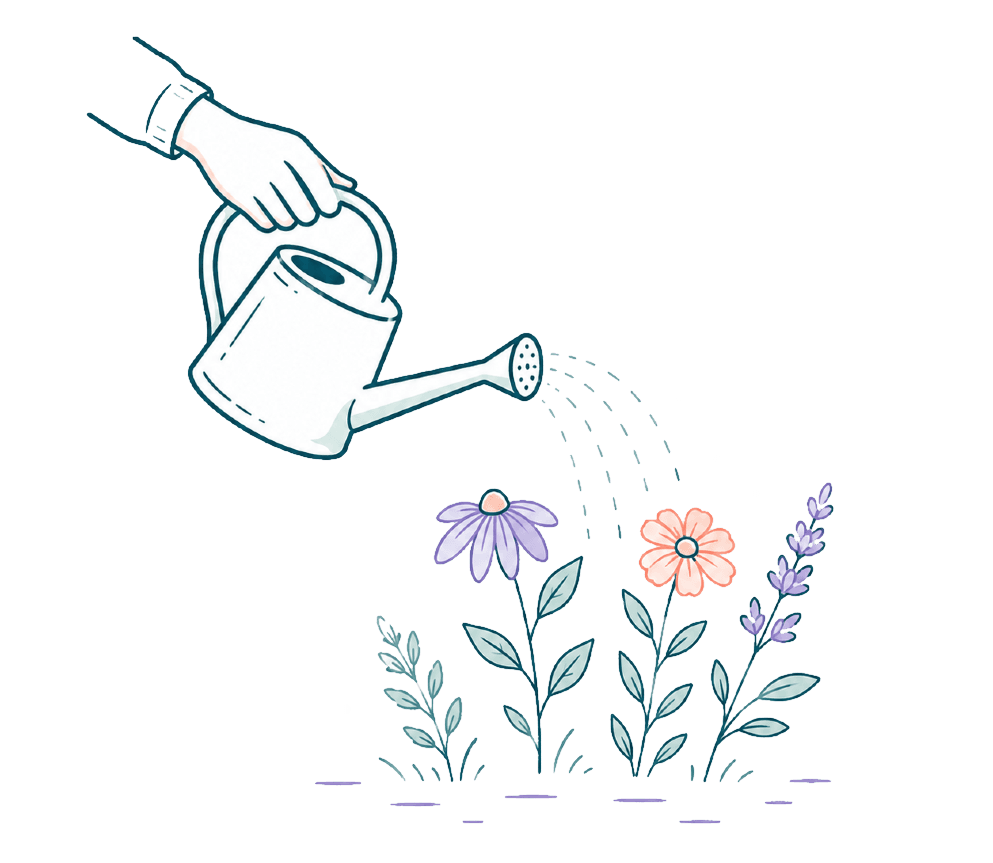 A hand tipping a watering can over blooming wildflowers