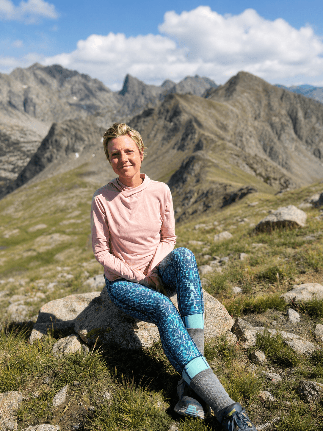 Tasha Darwent sitting in the Colorado foothills